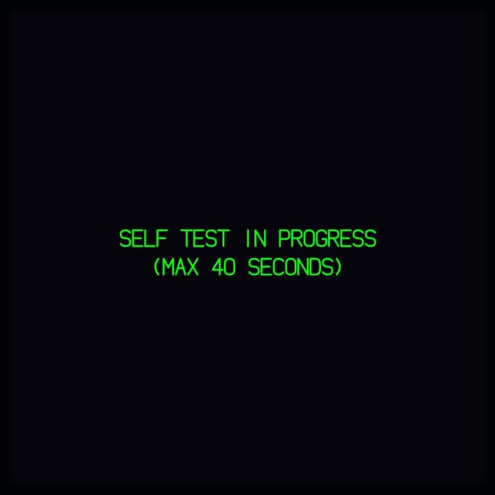 Capture of a display in Fly-K during its self-test: green text SELF TEST IN PROGRESS (MAX 40 SECONDS) on a black background.